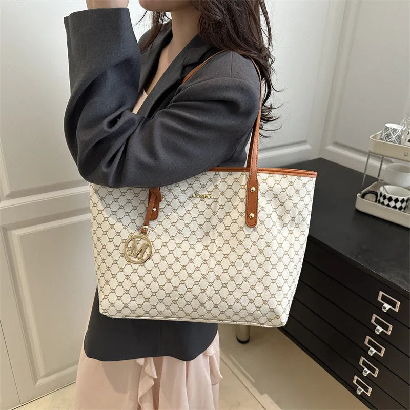 Street trend western style shoulder bag in PU material with sewn detailing, shown in black.