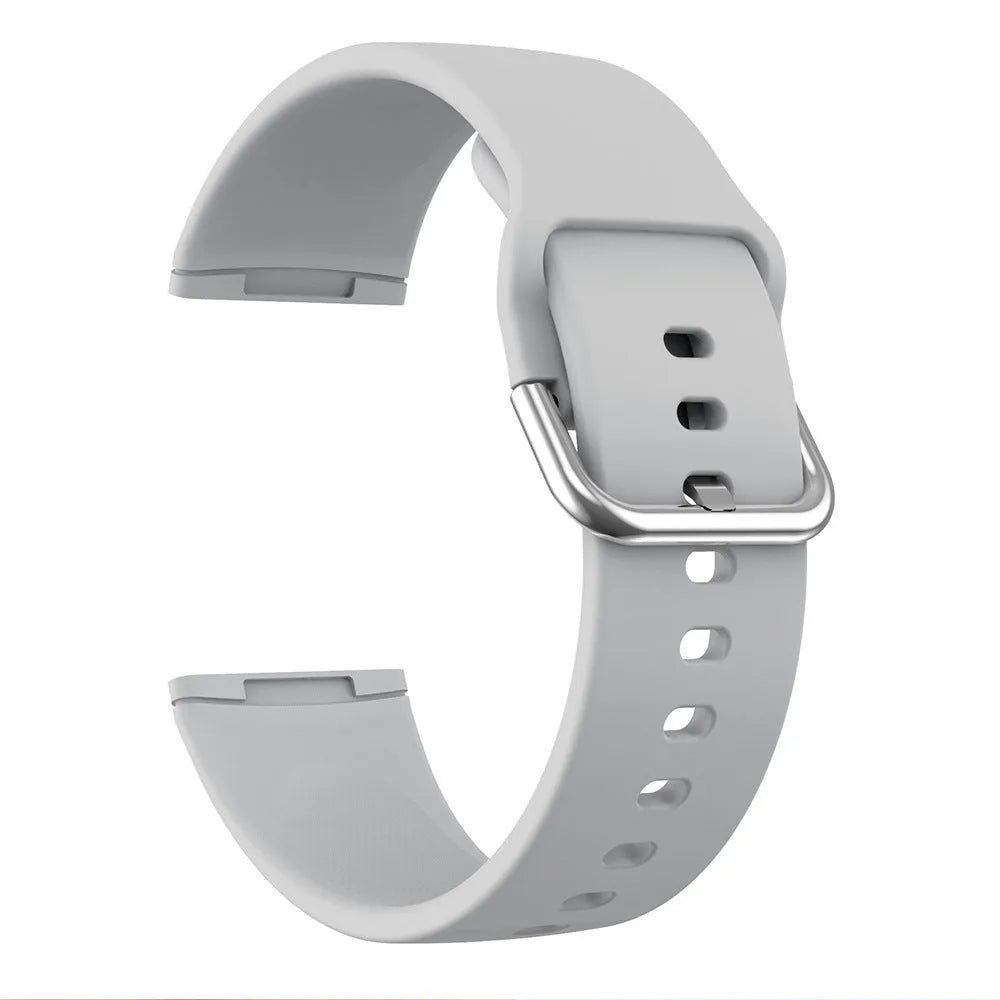 Solid colour silicone replacement strap with silver buckle for Fitbit Versa 3 and Sense 2 fitness trackers.
