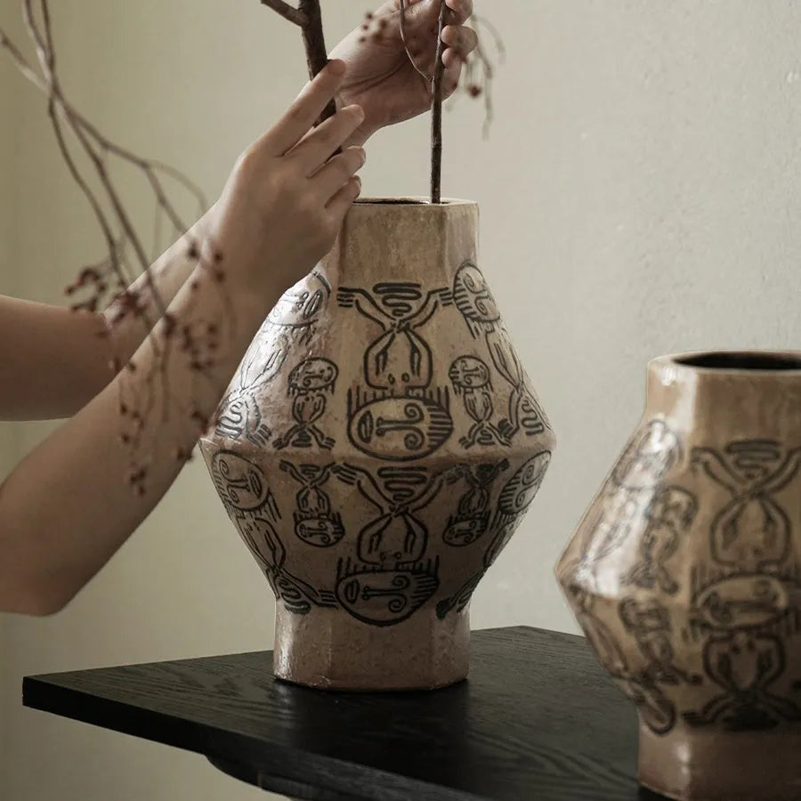 Hand-painted ceramic cylindrical vase with tribal totem patterns in vintage carved style