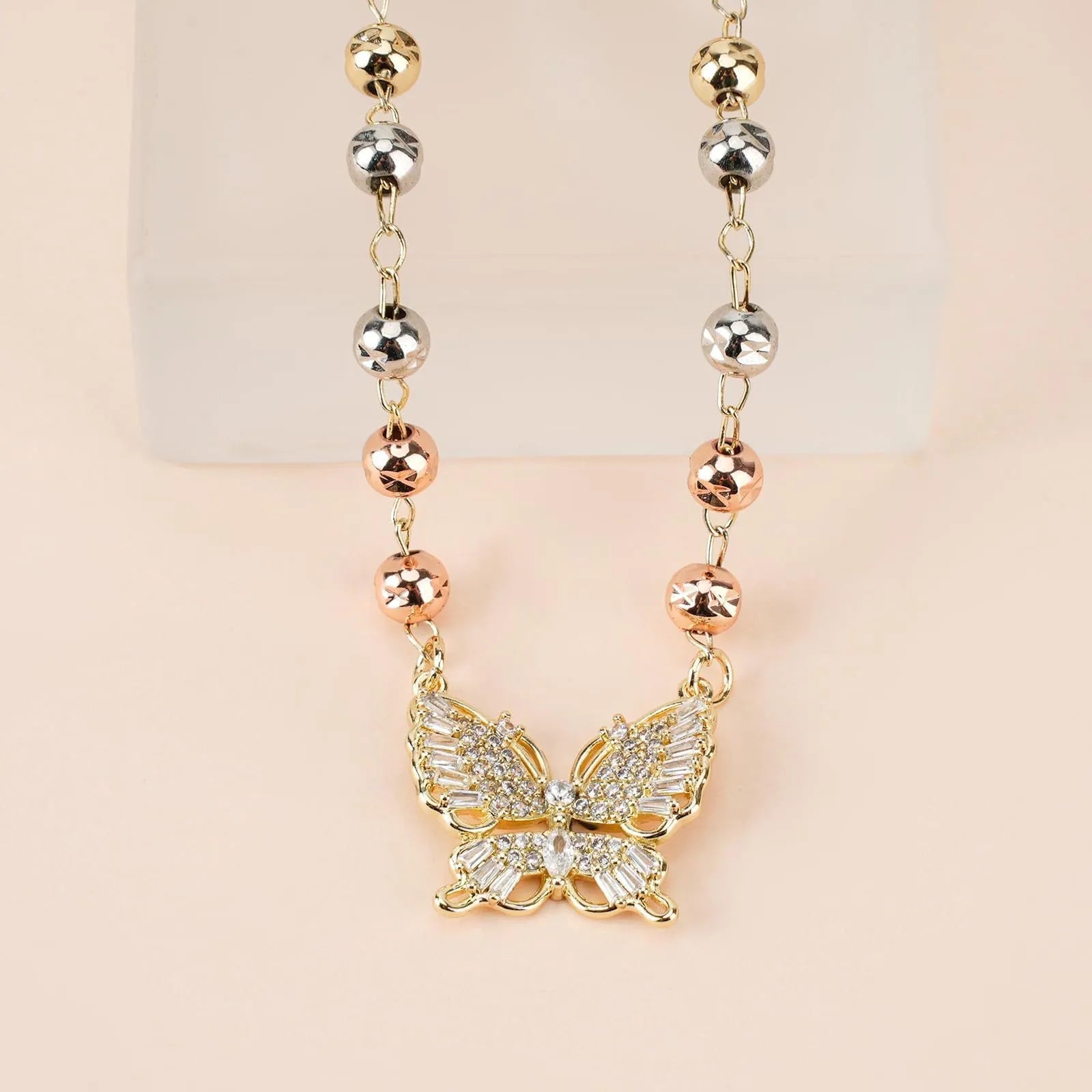 Gold butterfly necklace with zircon inlay on adjustable stainless steel chain, simple bow design for women