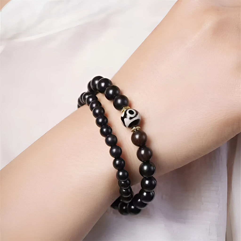 Ebony bracelet with Tibet beads design showing two-tone colour circles and 8mm diameter