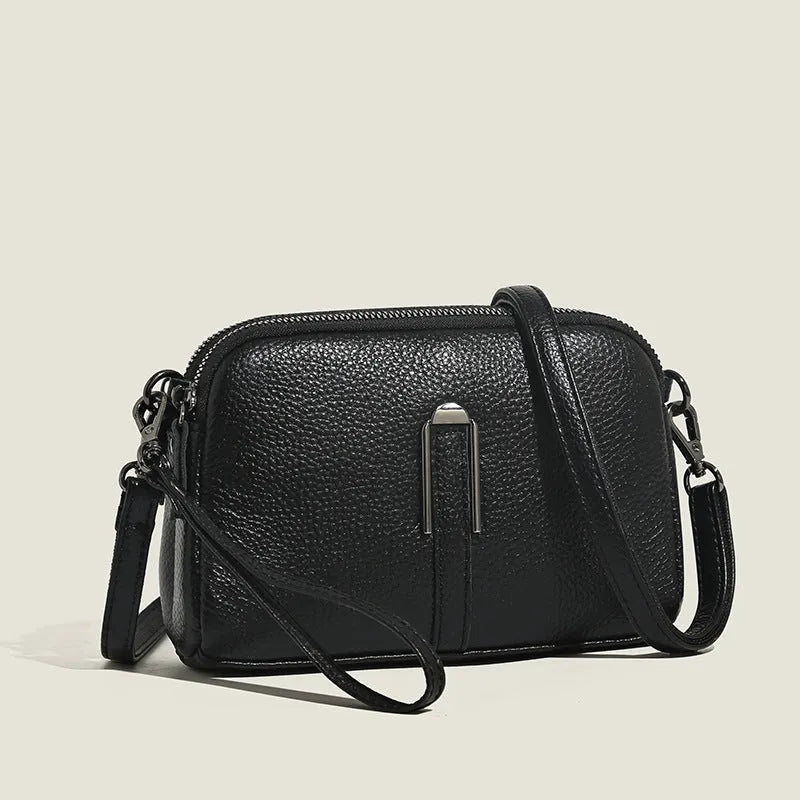 Genuine leather women's square shoulder bag in dark green, showing its horizontal 19x13x6cm shape.
