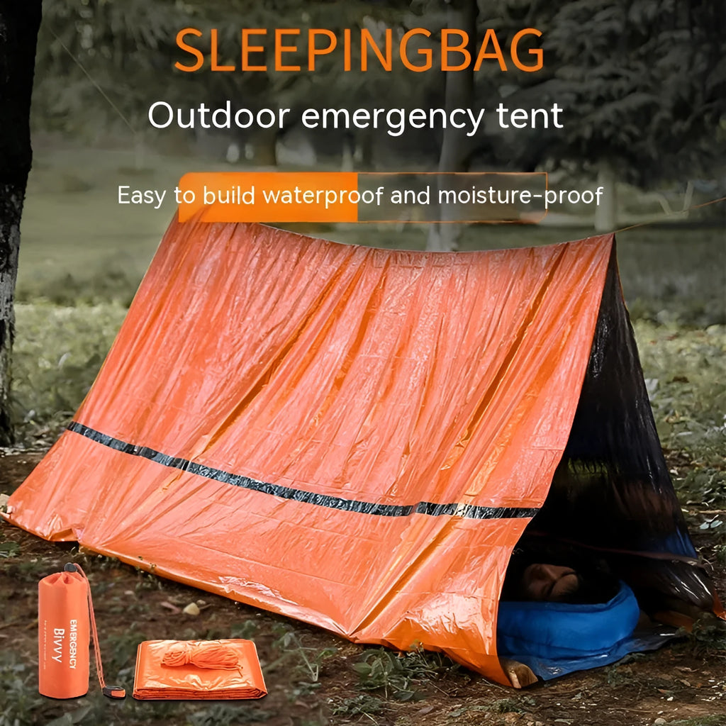 Orange emergency relief tent with sleeping bag and raincoat in temporary outdoor shelter setup
