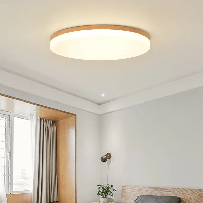 Japanese minimalist wood and acrylic LED ceiling lamp with three colour light settings.