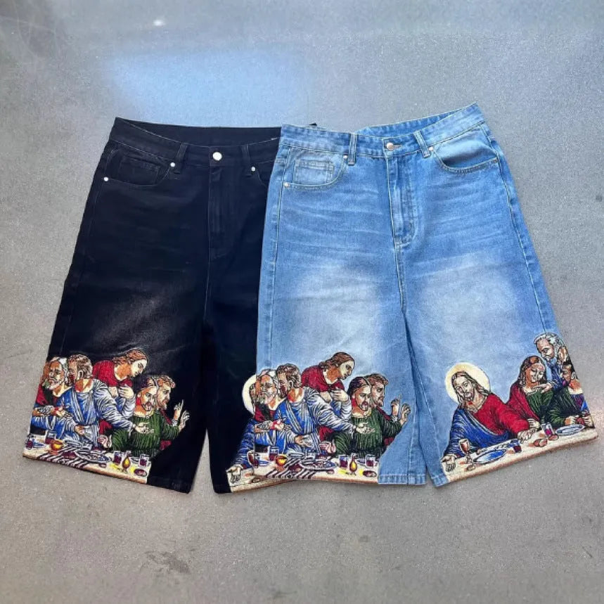 Blue cotton men's shorts with a Jesus Christ screen print on the back pocket, showing tapered leg fit.