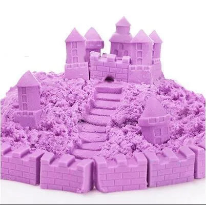 Kinetic space sand in multiple colours including blue, green, orange, pink, purple, red, rose, and sand colour in plastic bag packaging