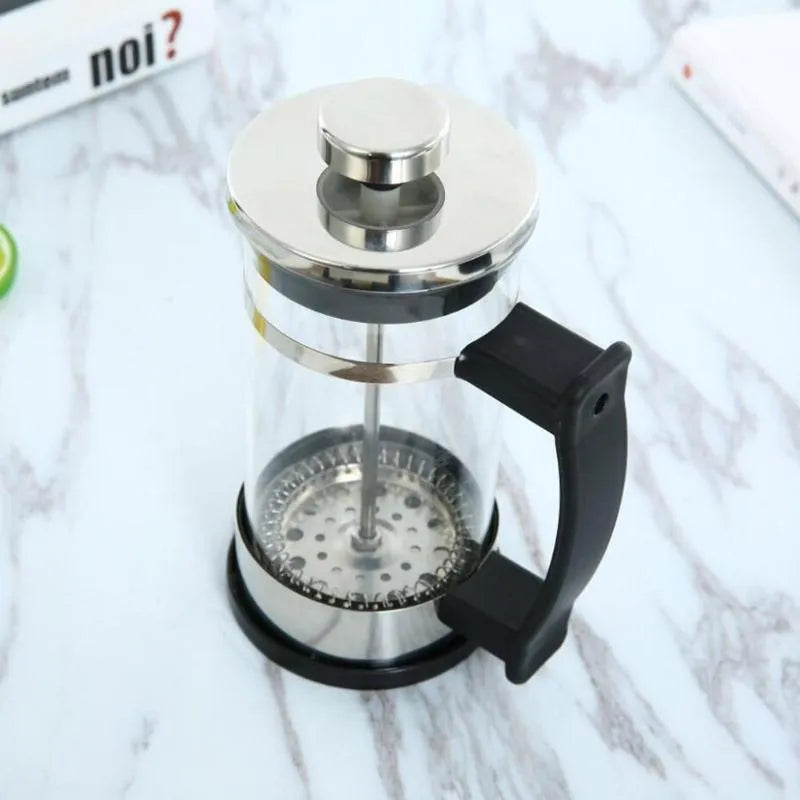 Manual glass and stainless steel pour-over coffee maker with 350ml capacity.