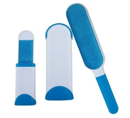 Blue reusable pet hair removal brush with a self-cleaning base, placed on a grey sofa.