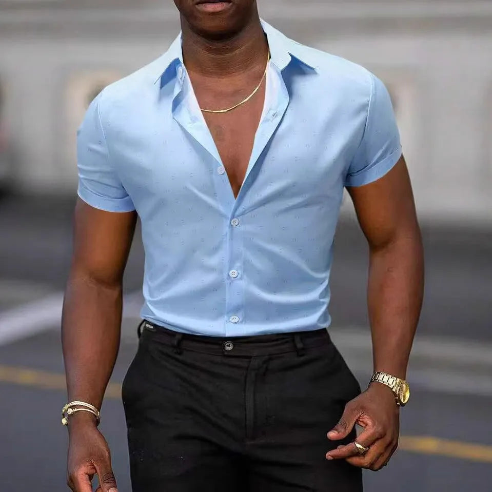 Man wearing light blue short-sleeved shirt with floral pattern, made from stretch polyester fabric