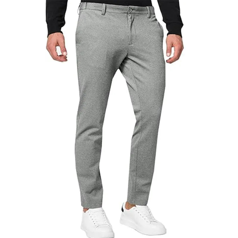 Men's slim-fit tapered chino pants in Army Green colour, showing pleated front and zipper fly detail.