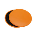 Two pink fitness sliding discs on hard floor showing double-sided texture, 18x18x2cm