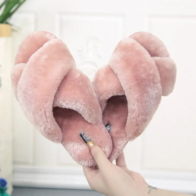 Cross open-toe fur slippers in multiple colours on a patterned non-slip sole.