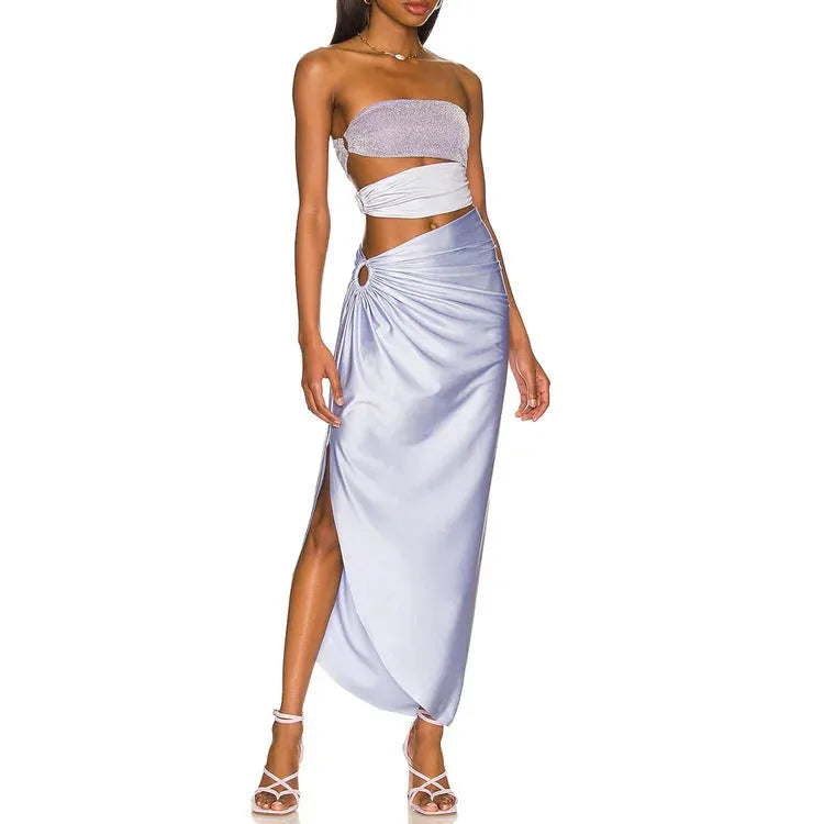 Purple one-piece swimsuit with a separate matching wrap skirt laid flat.