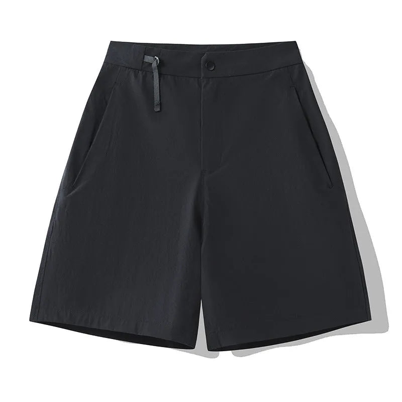 Men's solid colour quick-dry sports shorts with elastic waistband on a grey background.
