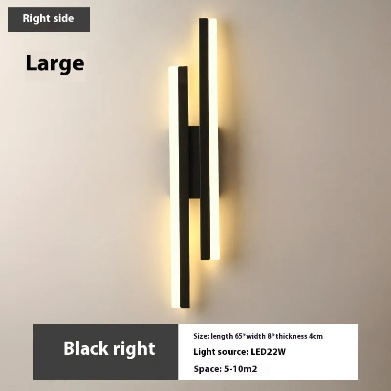 Modern Scandinavian minimalist LED wall light with acrylic shade in black or gold finish.