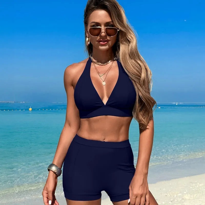 Women's black split bikini swimsuit made of nylon with polyester lining.