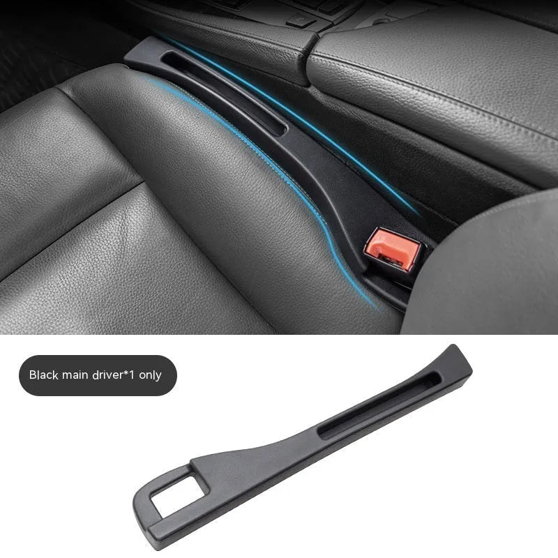 Black plastic car seat gap storage box with handle installed between car seats