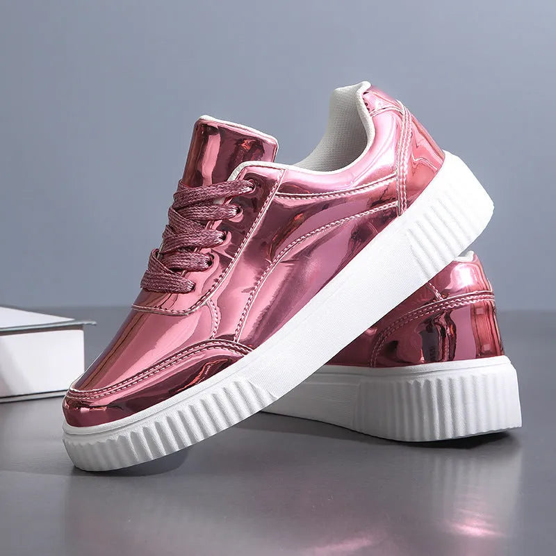 Rose gold platform sneaker with sequin details and a thick, light-coloured sole.