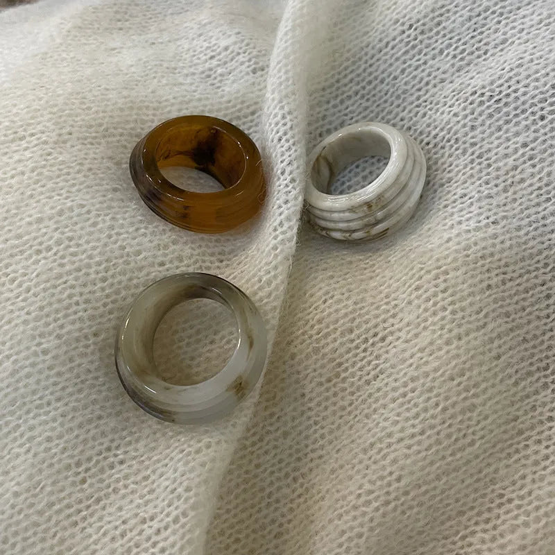 Chinese style geometric resin ring with irregular wide band design in brown and white colour options