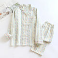 Ladies' cotton double-layer gauze homewear set with long sleeves and trousers in a striped or fruit print pattern.