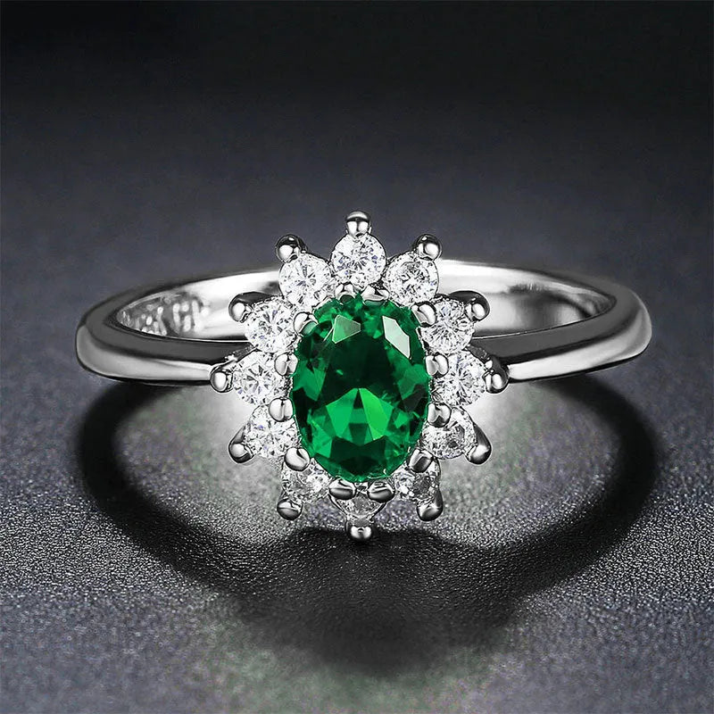 Women's blue moissanite and copper floral ring on a finger, showing zirconium inlay and electroplated colour.