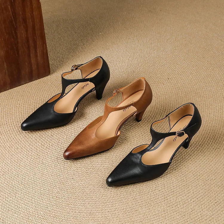 Brown retro women's T-strap closed toe sandals with a buckle and short block heel.