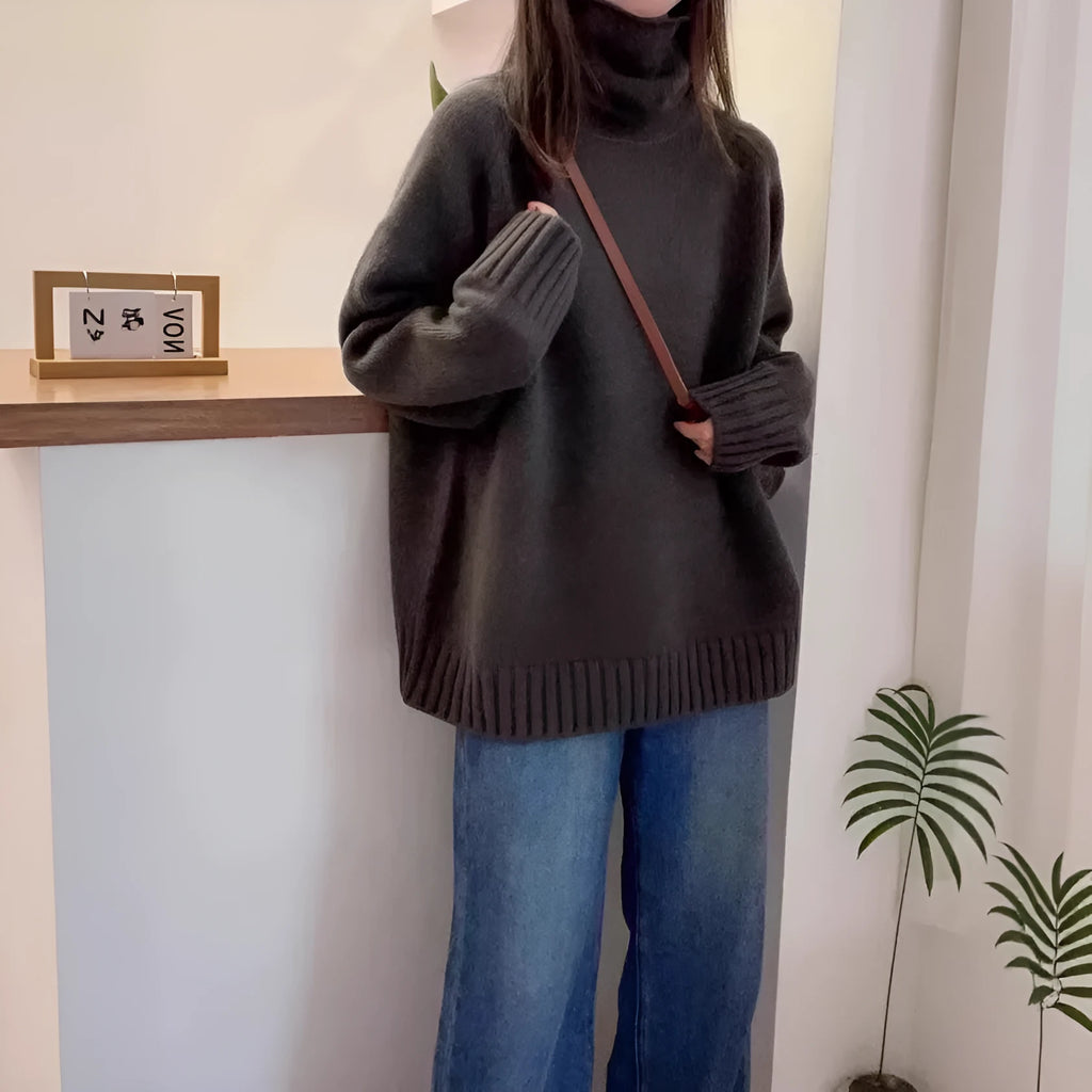 Women's loose thick turtleneck sweater with a textured 3D curling collar in a red solid colour.