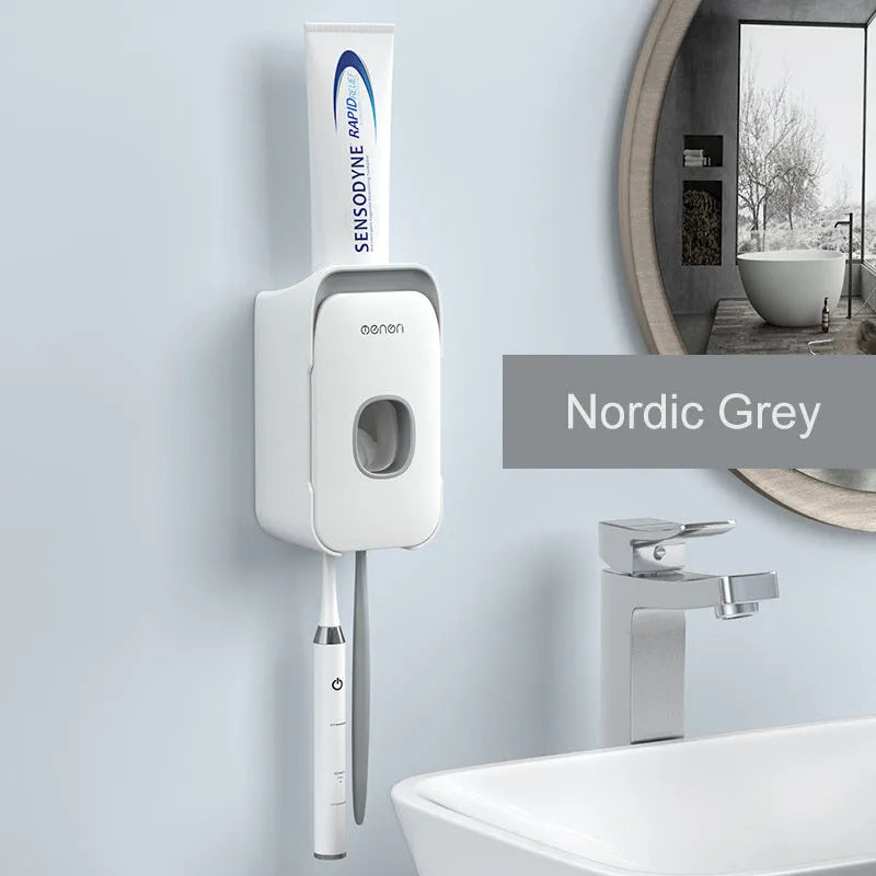 Blue automatic toothpaste dispenser made of ABS plastic on a bathroom shelf.