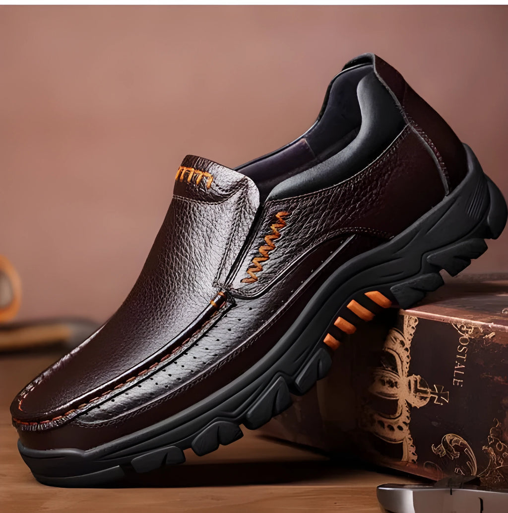 Men's black and brown cowhide leather business casual slip-on shoes with a rubber sole.