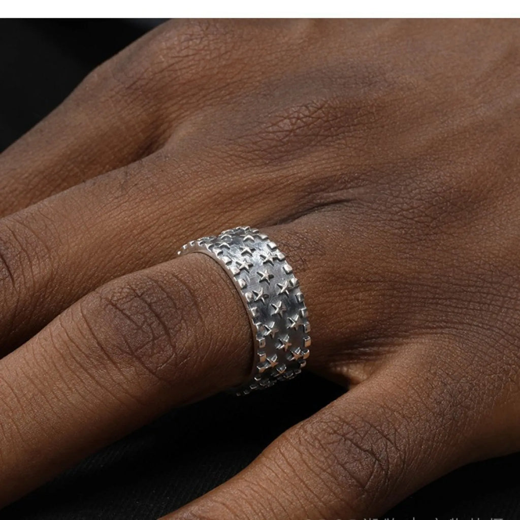Sterling silver ring with five-pointed star design and adjustable opening
