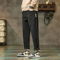 Corduroy men's casual straight-leg trousers in solid colour with mid-waist rise and zipper fly