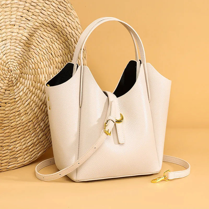 Genuine leather women's retro bucket bag in beige with top handle and sandwich pocket