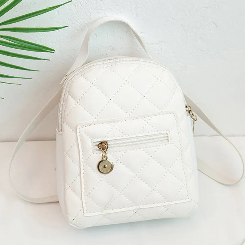 Hard white Korean style embroidered girls backpack showing sandwich pocket and soft carry handle.