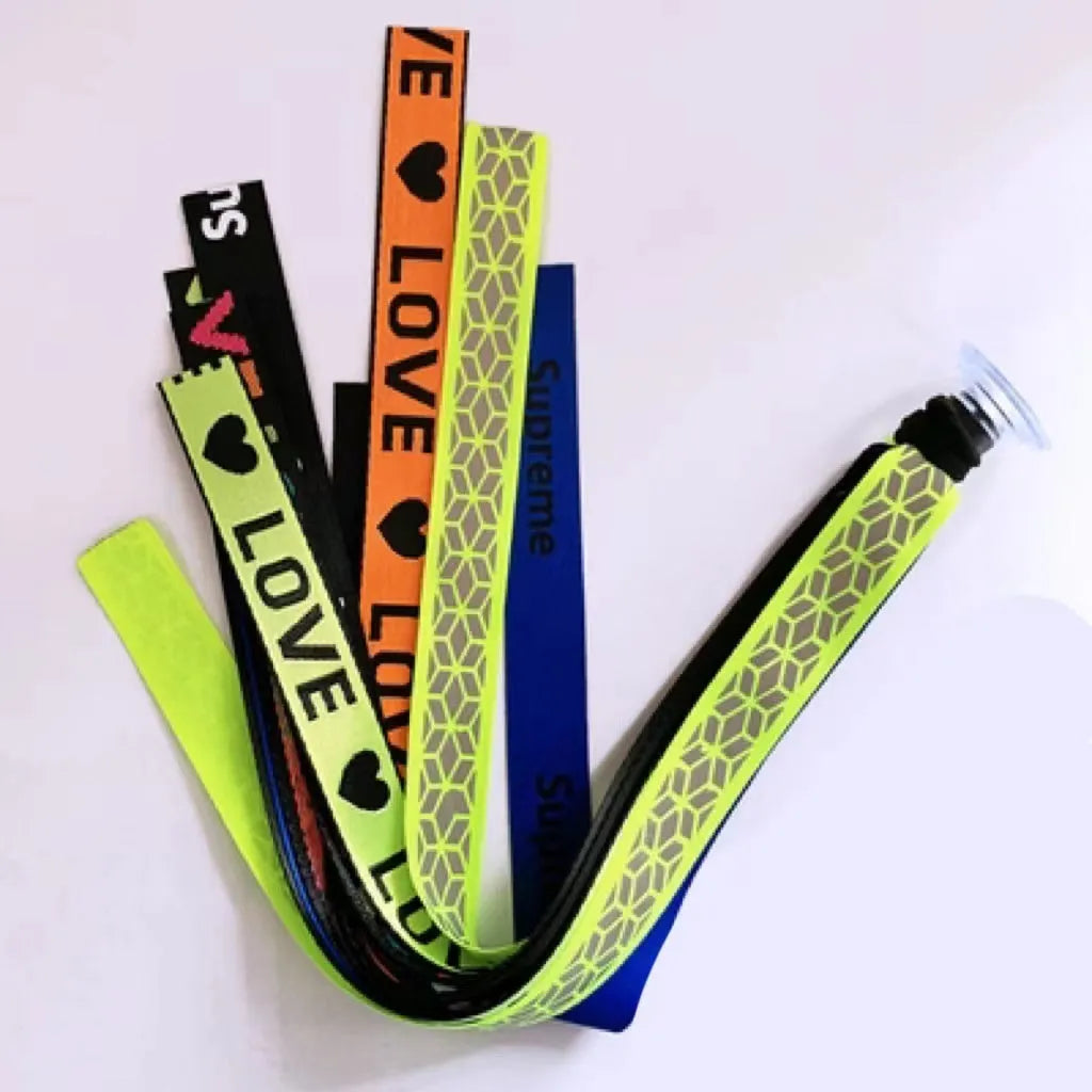 Colourful decorative ribbon streamers attached to a children safety helmet for skating or skiing