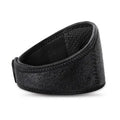 Black self-heating magnetic therapy neck guard with adjustable strap on a flat surface.