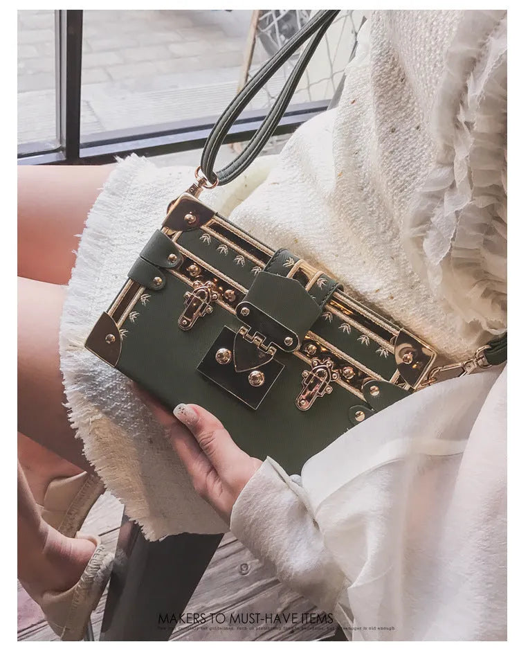 Women's black PU leather hard flap shoulder bag with decorative rivets and hasp closure