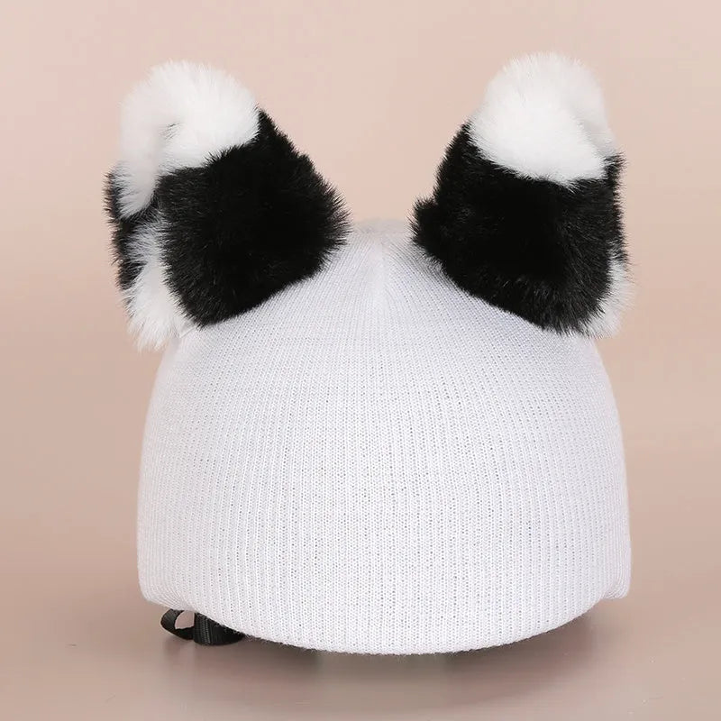 Cute plush cartoon animal character hat designed to decorate a standard ski helmet.