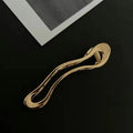 Gold and silver zinc alloy barrettes in square, arc, and triangle shapes for women
