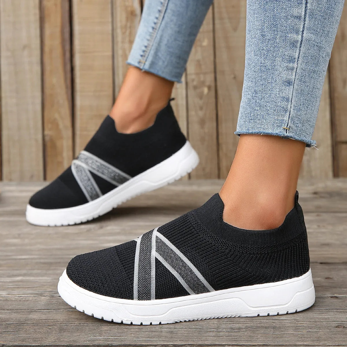 Black women's flat mesh shoes with flyknit fabric upper and tassel detail