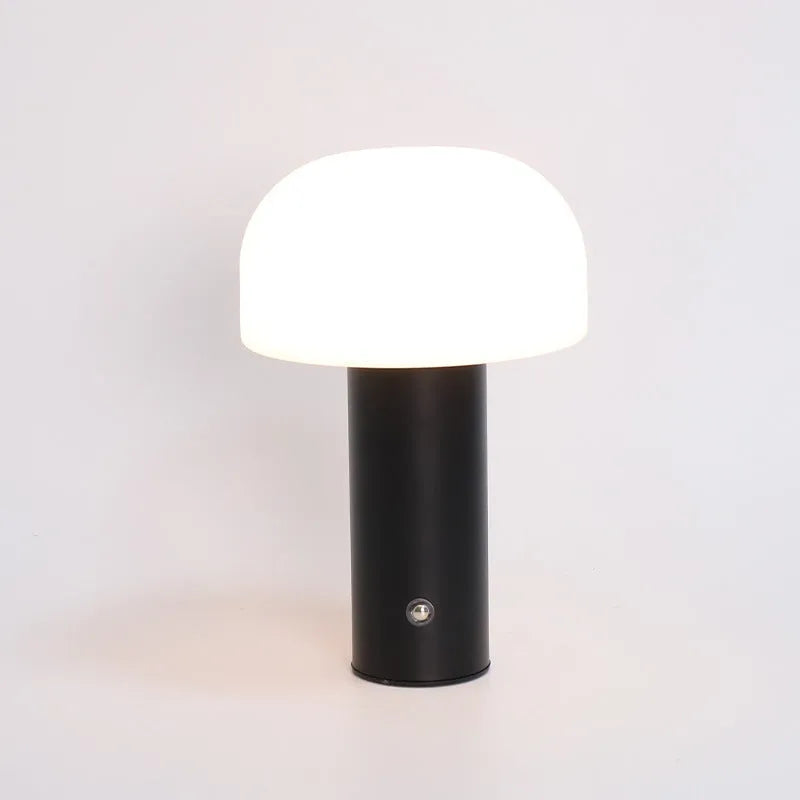 USB table lamp in black, green, orange, or white colours on a desk surface