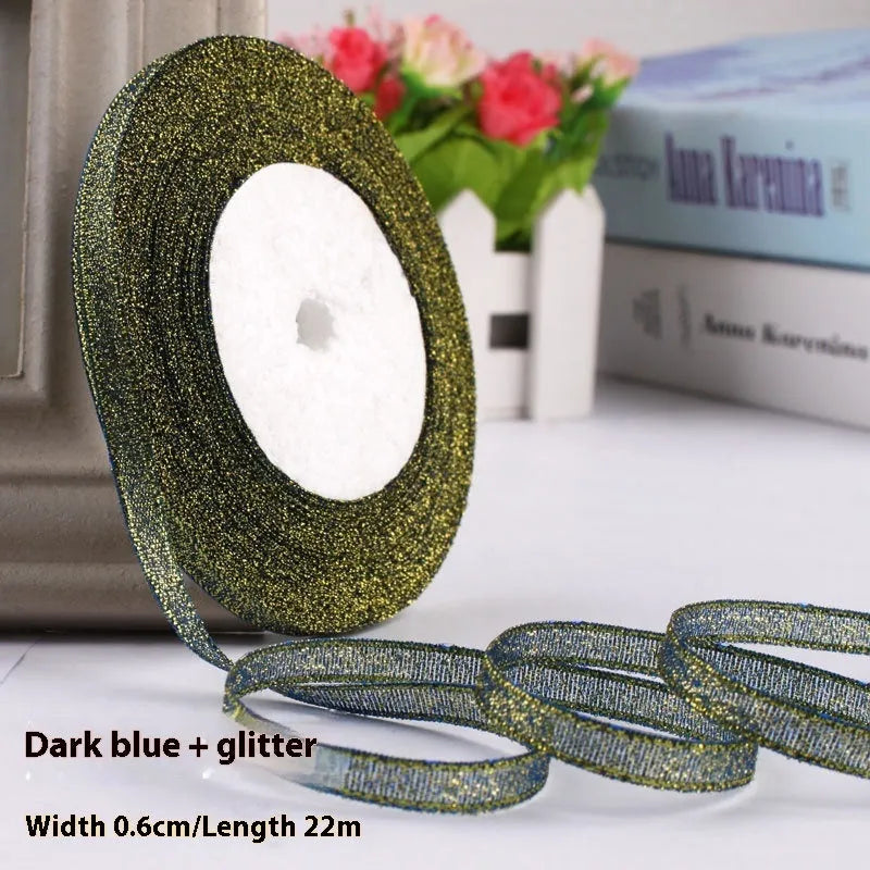 Roll of 0.6cm wide polyester gift ribbon in various colours including gold leaf, coffee and sky blue options