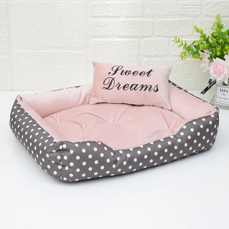 Small polka dot print dog bed with a square cushion, shown in grey colour.