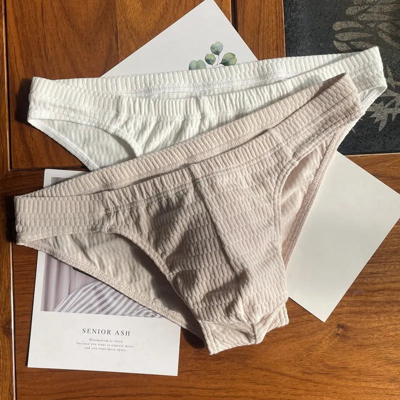 Men's solid colour pure cotton triangle briefs with a mid-waist body-shaping design.