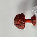 Mushroom cloud shaped atomic explosion table lamp with USB power cable on a desk.