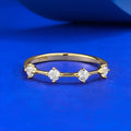 Gold electroplated minimalist ring with a row of small diamonds on silver band