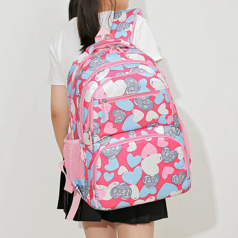 Children's large capacity Oxford cloth schoolbag with air pillow belt in blue, pink, gray, or rose red for burden alleviation