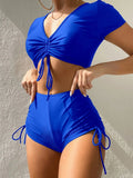 Women's dark green lace-up front swimsuit top with matching shorts on a mannequin