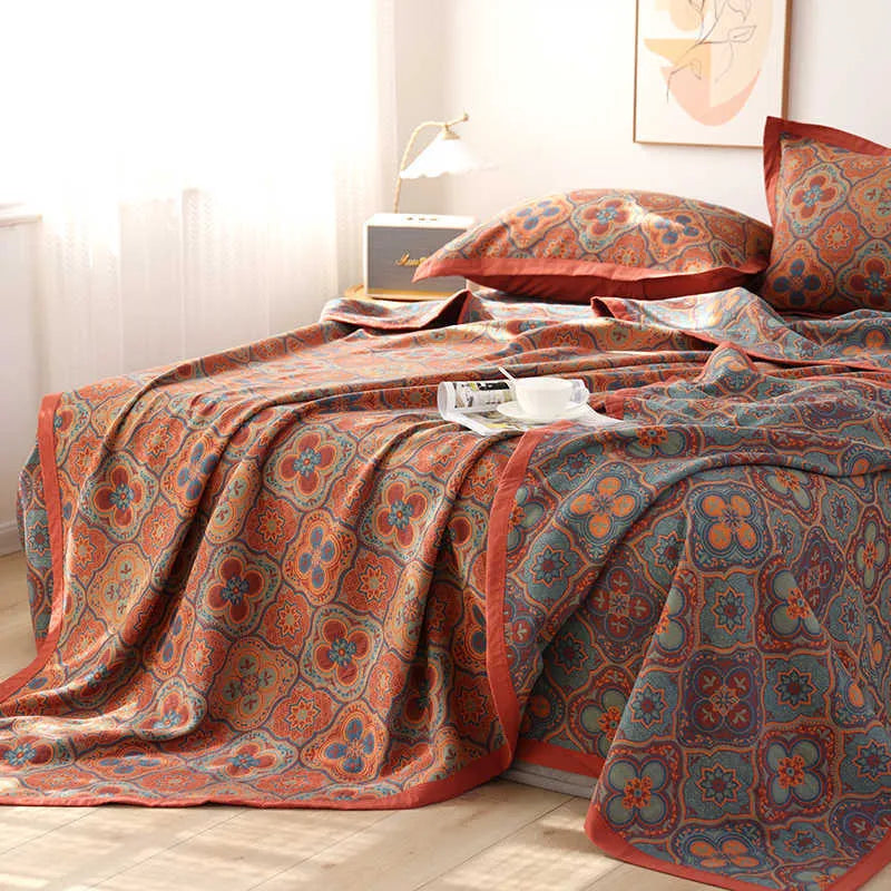 Cotton gauze bed blanket set with plant and flower pattern showing blanket and two pillowcases