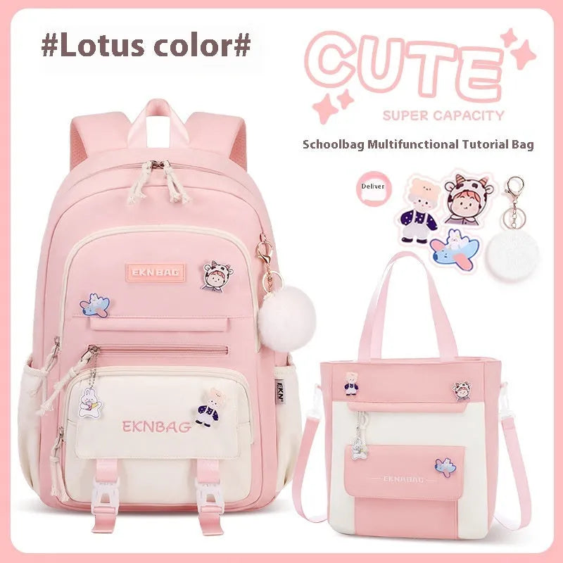 Pink waterproof Oxford cloth school backpack for girls with curved shoulder straps on a white background.