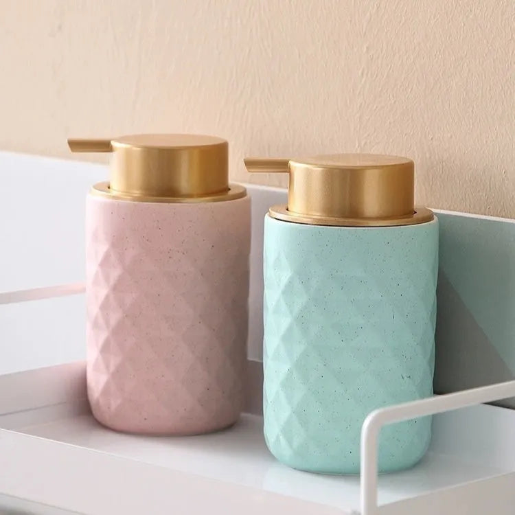 Large plastic foam pump dispenser for facial cleansers in a metallic gold finish